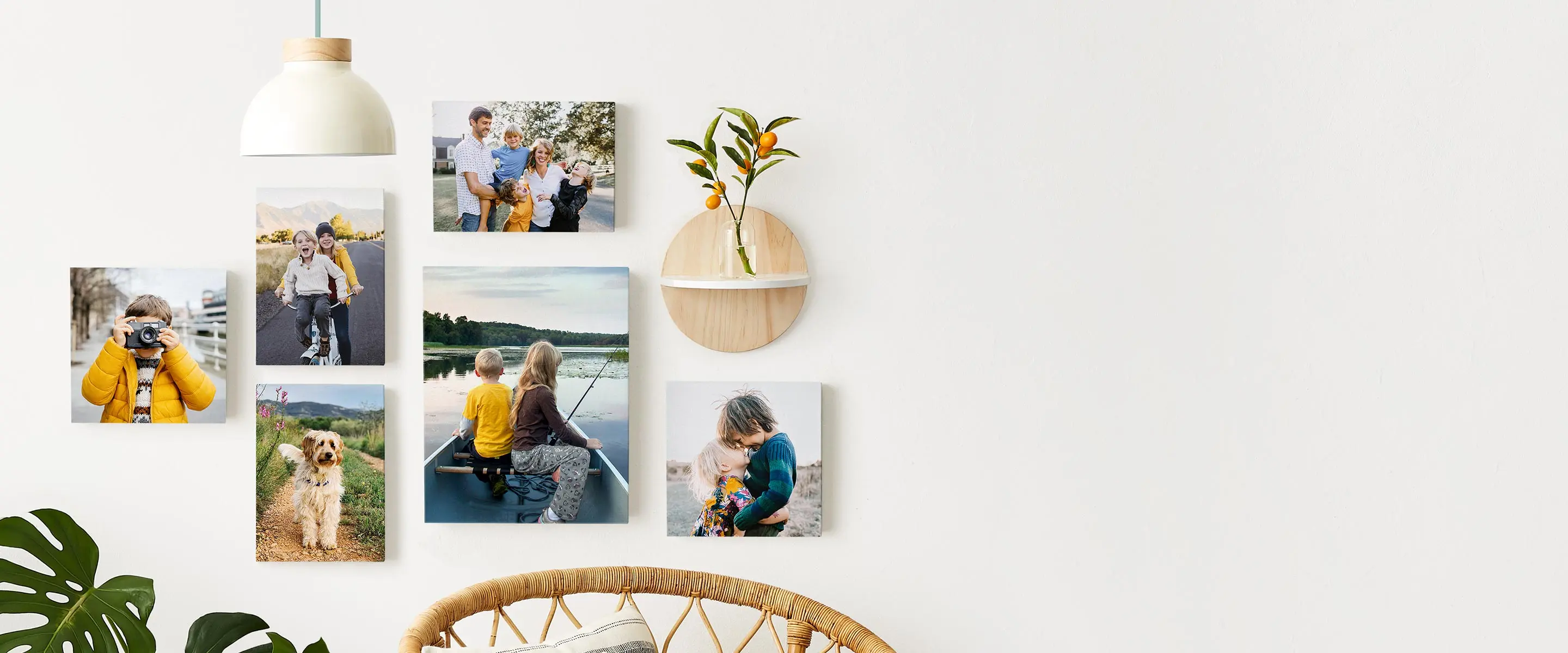 Canvas photo print gallery wall in home living room with images of family and kids.